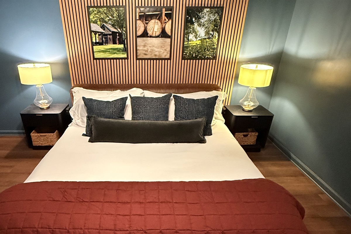 Curated with a collector’s eye and crafted for modern comfort — this bourbon-inspired bedroom pairs rich textures and tailored design with your host’s own framed photography, offering an atmosphere of refined warmth and executive ease.