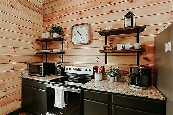 Start your day at the cozy coffee bar—complete with all the essentials for slow, comforting mountain mornings