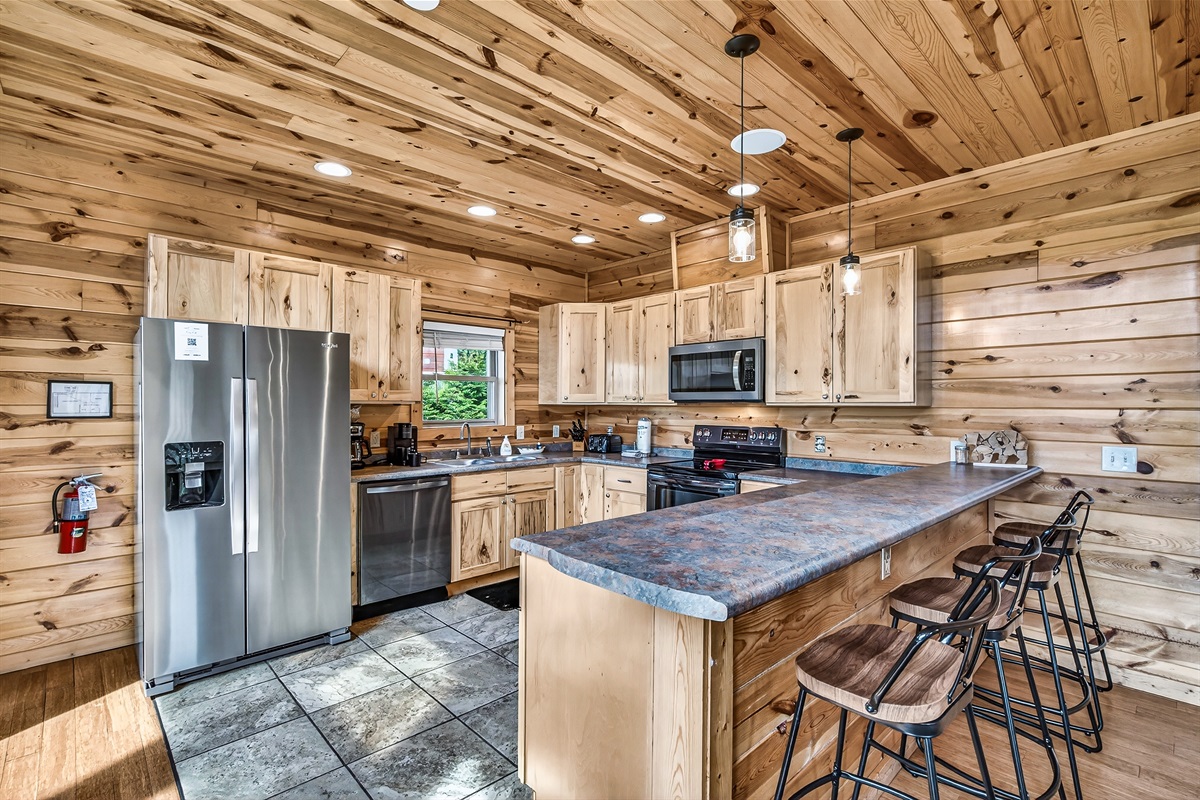 Fully Equipped Kitchen with both a traditional coffee and Keurig machines, oven, stove, microwave, toaster and dishwasher