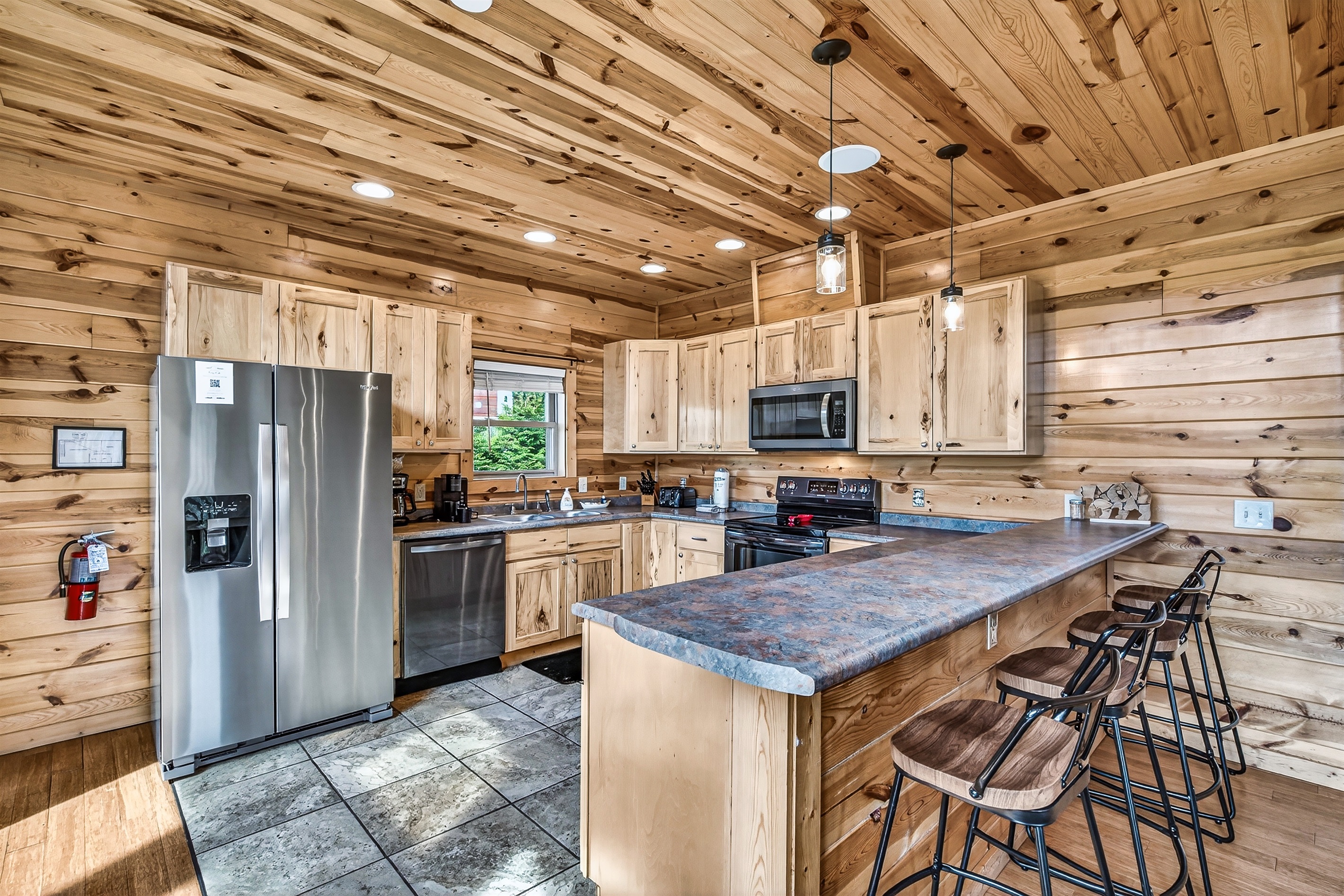 Fully Equipped Kitchen with both a traditional coffee and Keurig machines, oven, stove, microwave, toaster and dishwasher