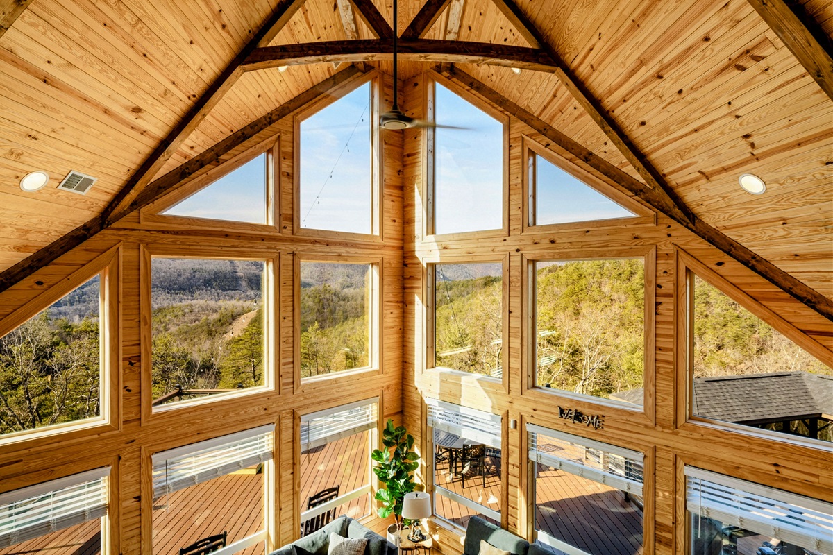 View from the Top – A stunning overlook of the Great Room and mountains beyond awaits from the loft.