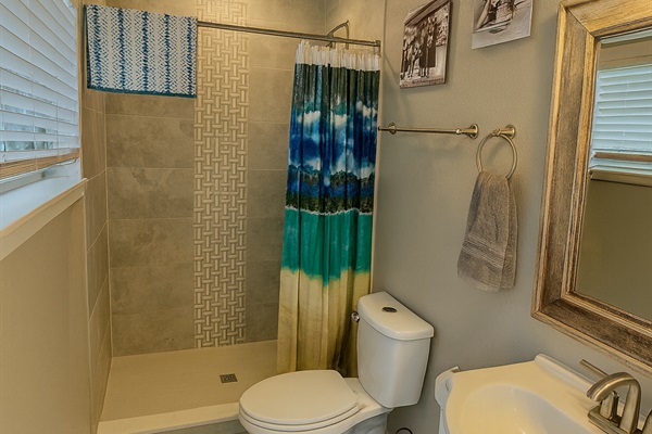 Relax and refresh in this cozy tiled bathroom