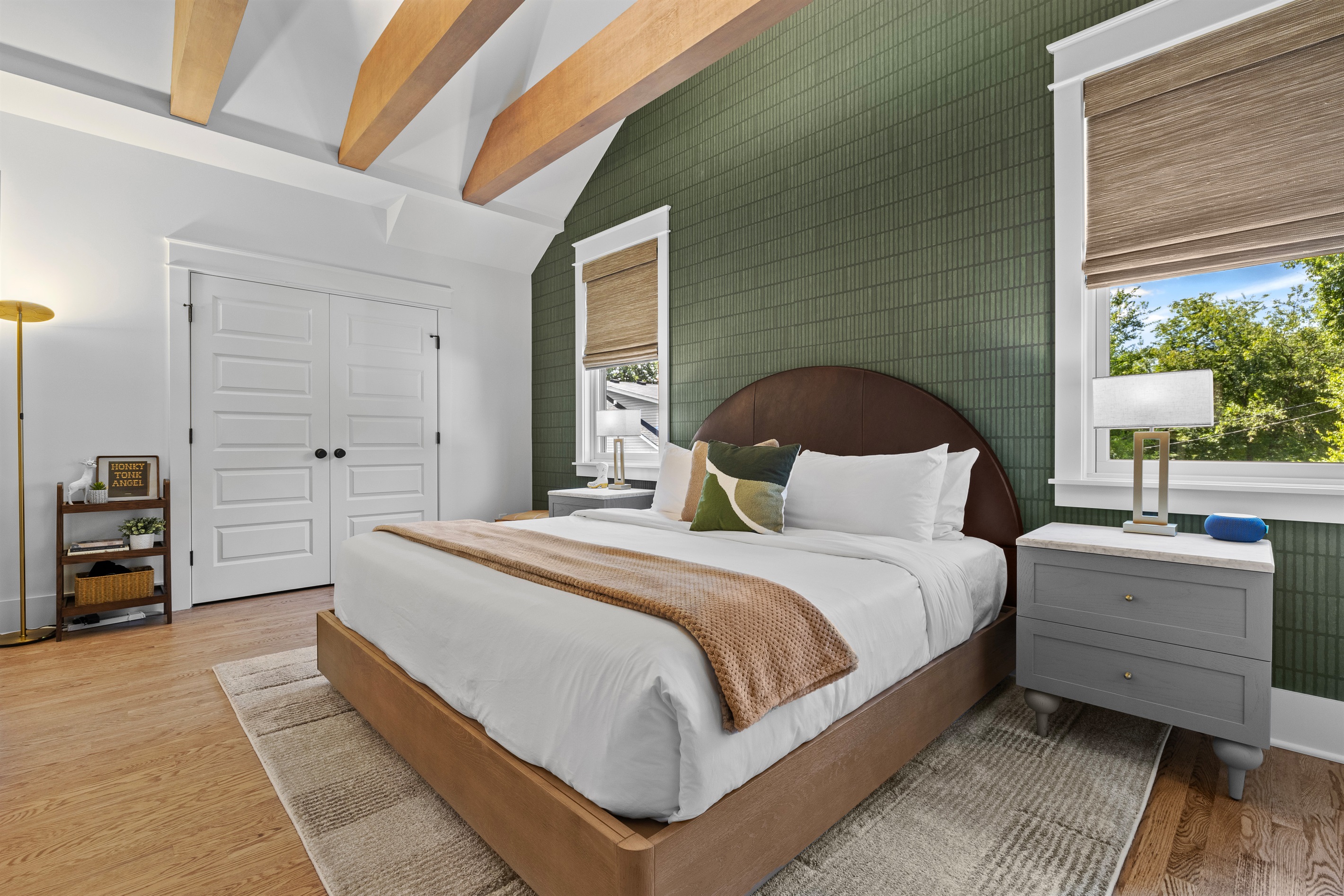 Spacious bedroom has ample storage and modern design details.