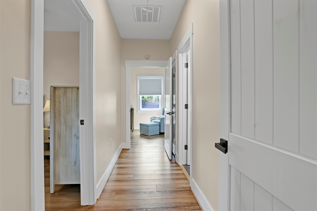 A central hallway seamlessly connects the home’s living spaces.