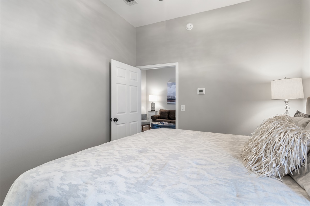  Bedroom with plush bedding and soft coastal lighting