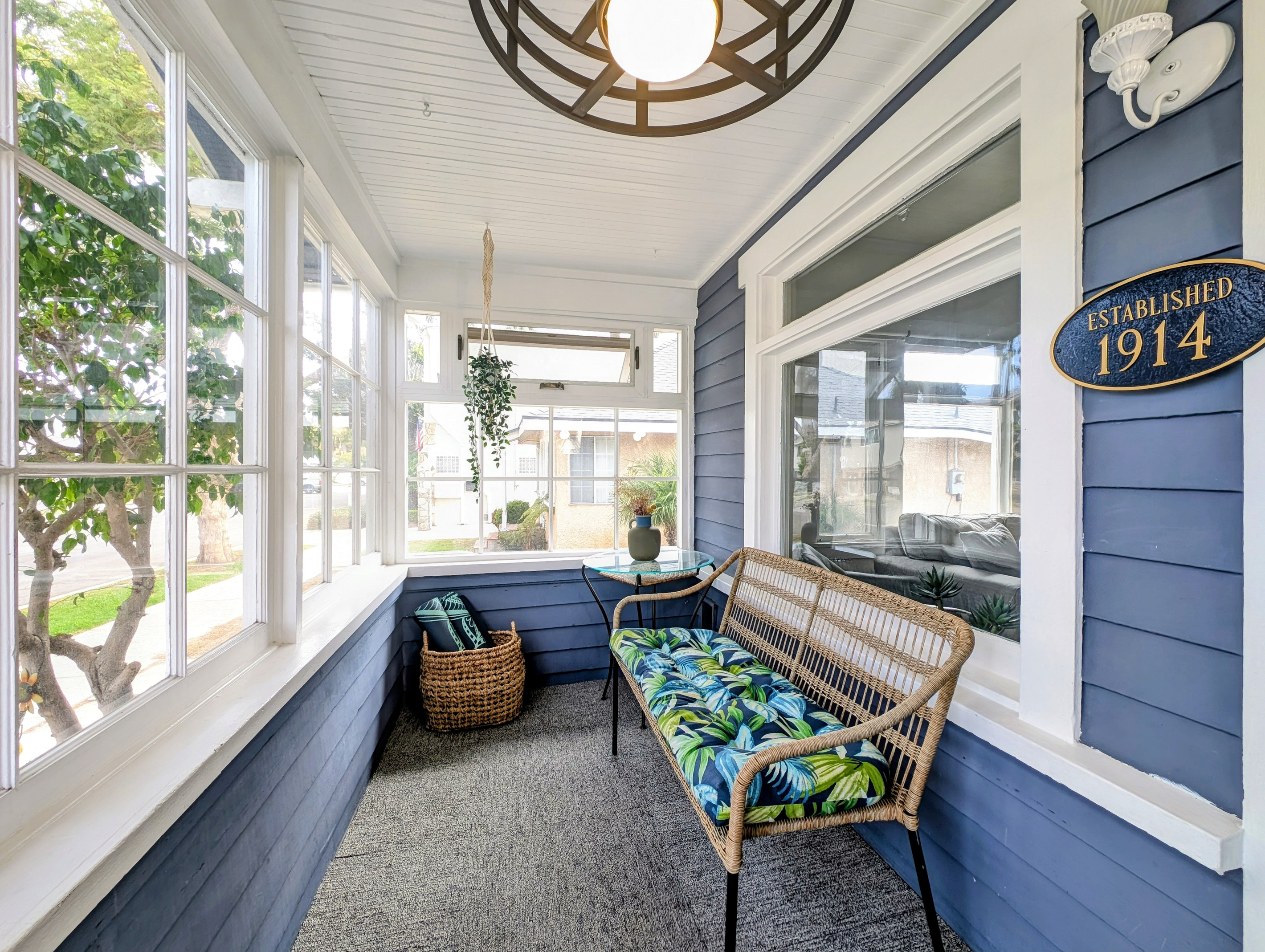 Cozy and bright sunroom with comfortable seating.