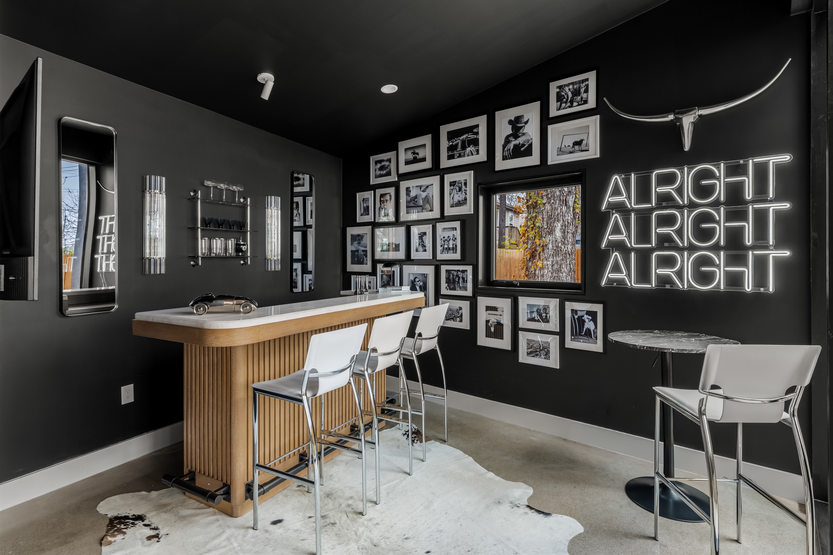 Chic indoor bar with modern seating and bold design—perfect for mixing drinks, hosting happy hour, or gathering with friends for a fun night in.