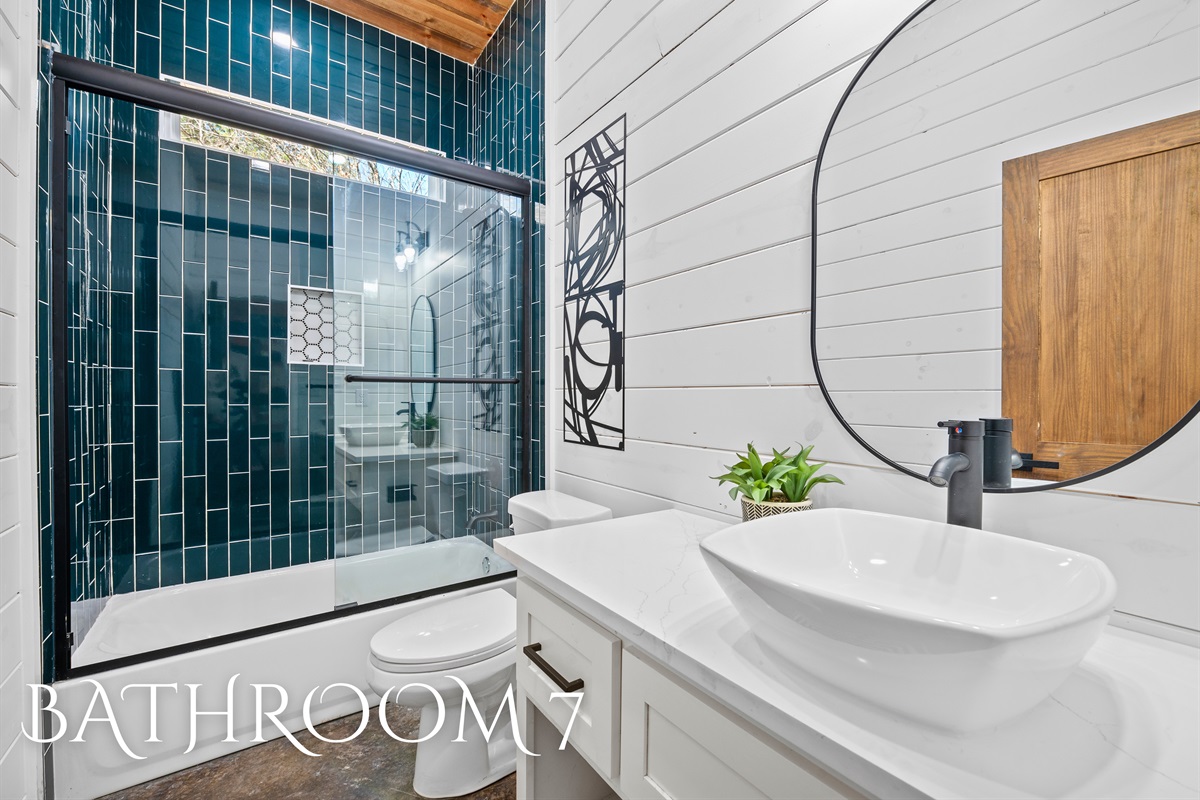 A modern bathroom with striking finishes, a sleek vanity, and an effortlessly stylish design.