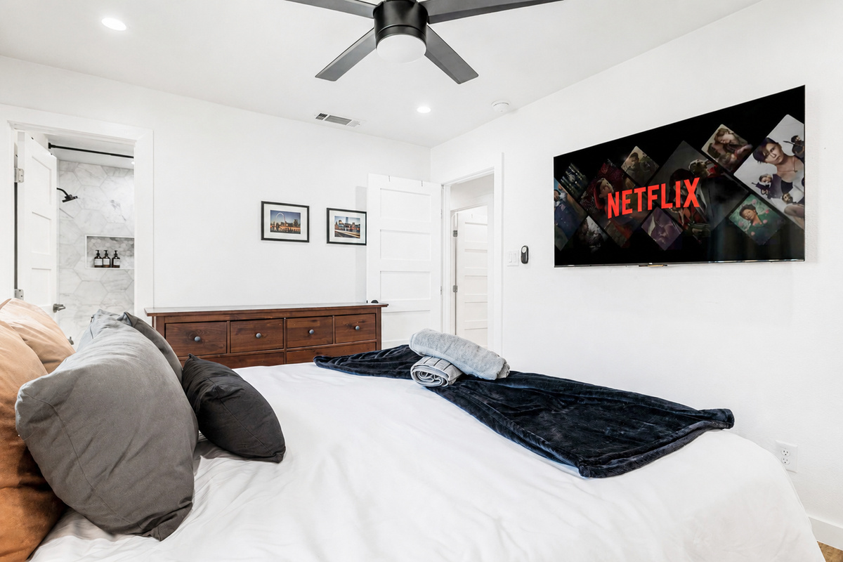 Unwind in style with a plush bed, smart TV, and sleek, modern decor!