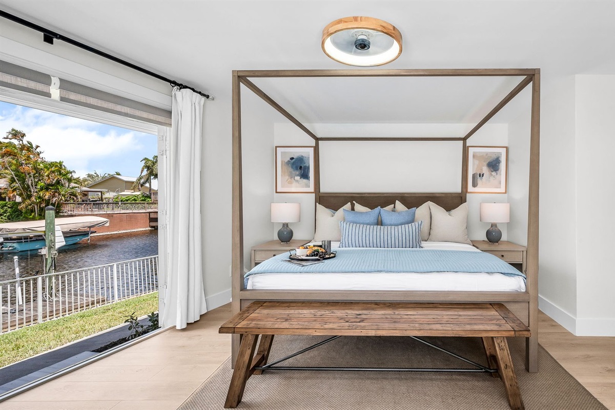 The primary king suite feels like your own private resort—featuring panoramic views of the pool and lake, seamless indoor-outdoor flow, and a newly renovated spa-inspired ensuite. Thoughtfully styled with designer finishes.