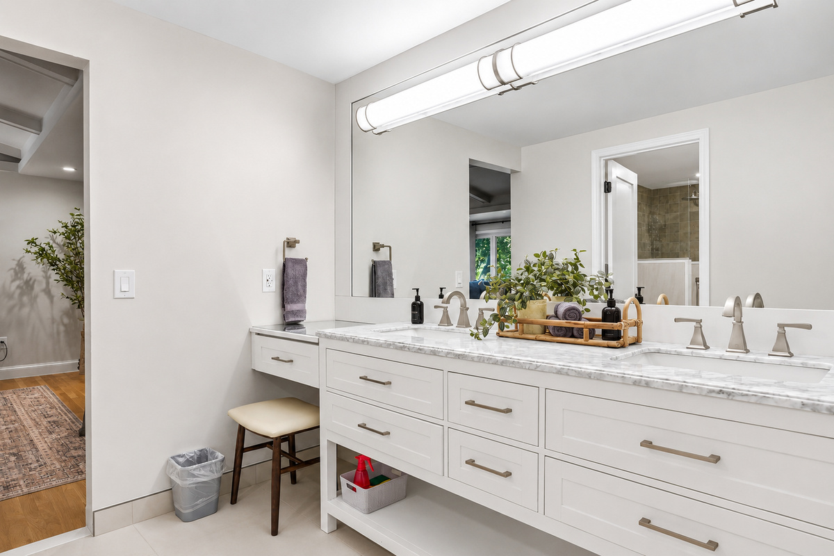 Enjoy the privacy of the primary bedroom's ensuite bathroom, complete with a spacious double vanity, oversized walk-in shower, stylish contemporary finishes, and thoughtful storage designed for comfort during your stay.