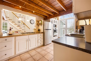 Fully stocked kitchen with penisula bar seating