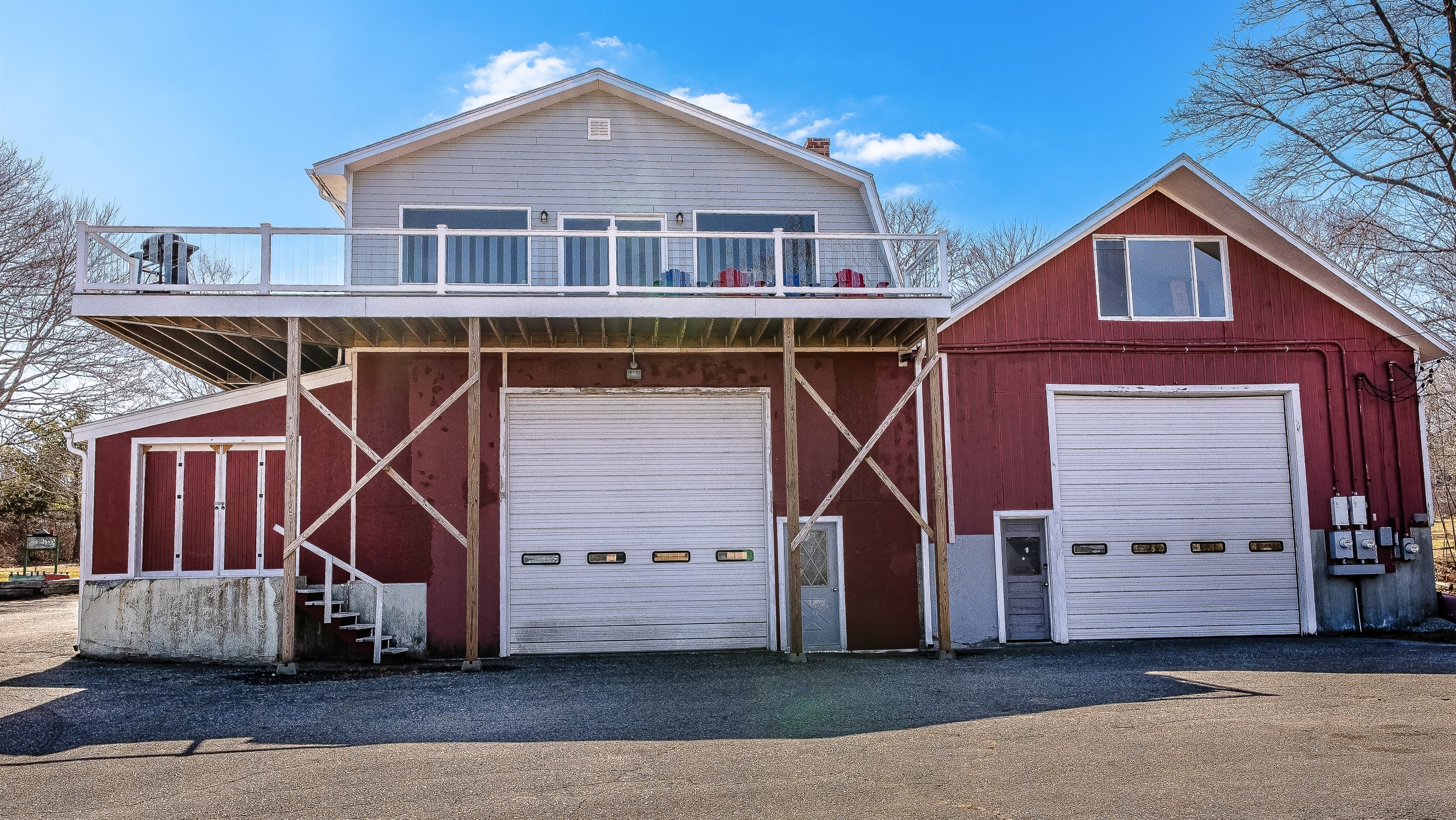 The Aerie: A high-elevation maritime loft perched above its historic "Quiet Side" roots. This front-on view showcases the impressive height of our 75-foot wrap-around deck, offering your group a private, bird's-eye perspective of Southwest Harbor.