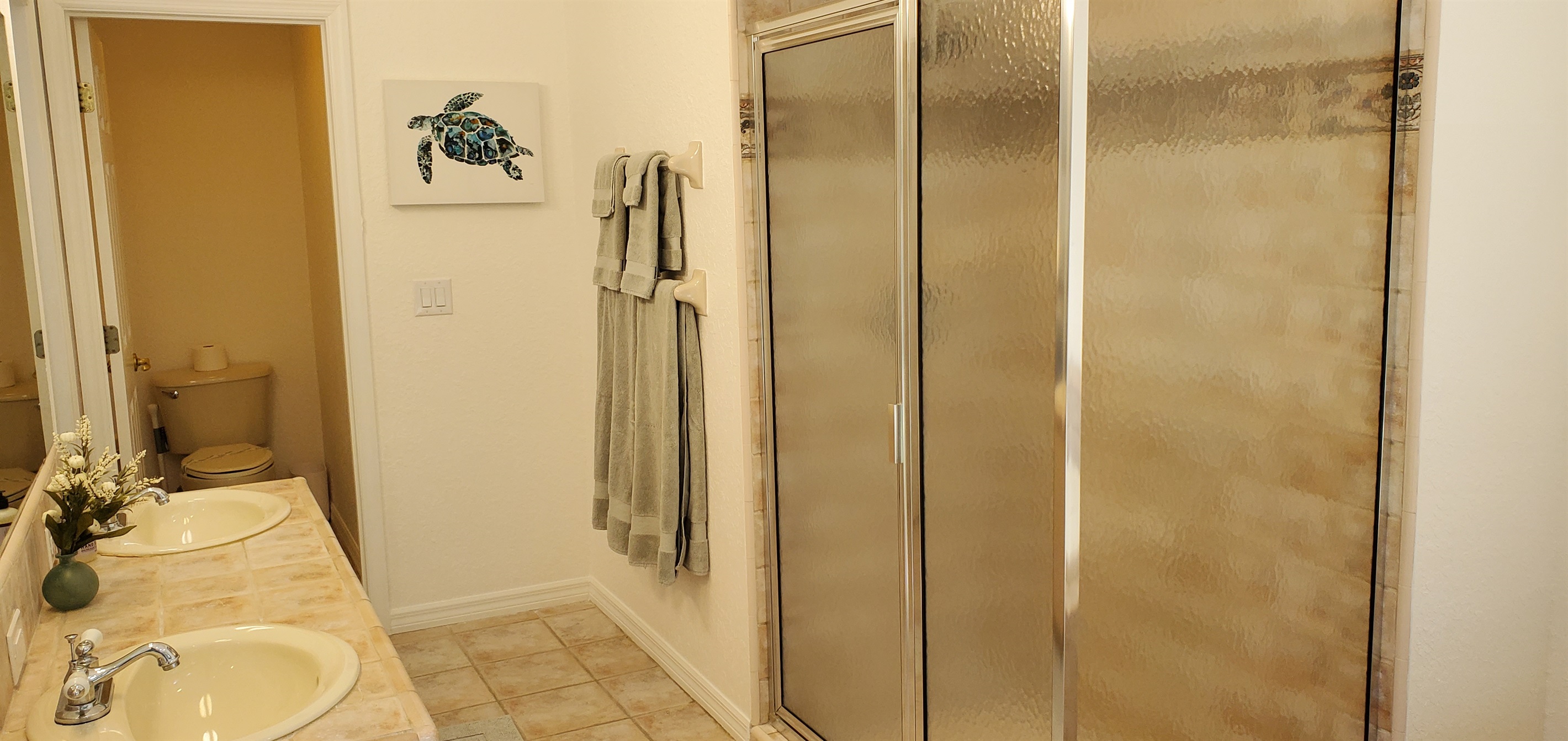 Master Queen bathroom with double sinks, walk-in shower and sunk-in tub.