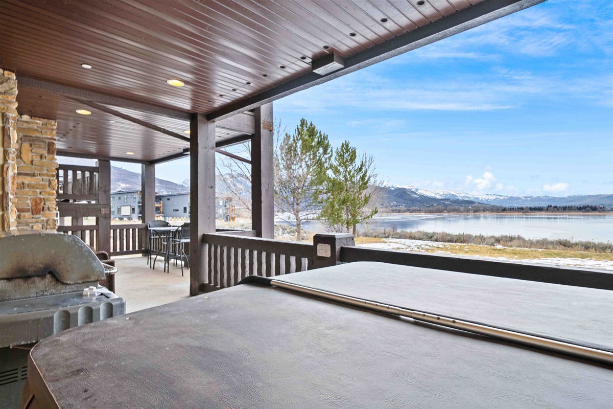 Covered patio space perfect for outdoor dining and relaxing year-round.