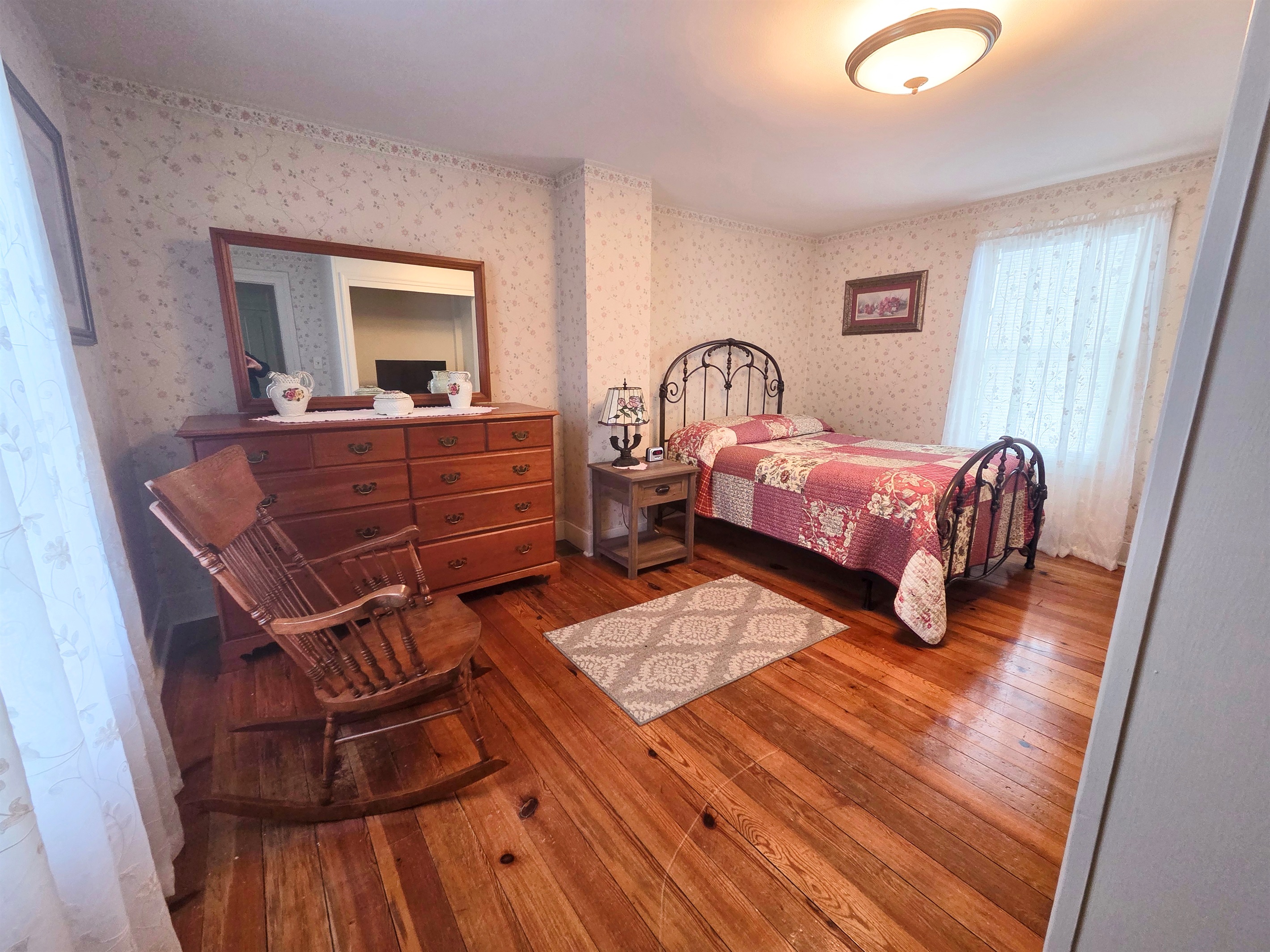 Third Upstairs bedroom featuring a comfortable full bed, with convenient access to the shared Jack-and-Jill bathroom.