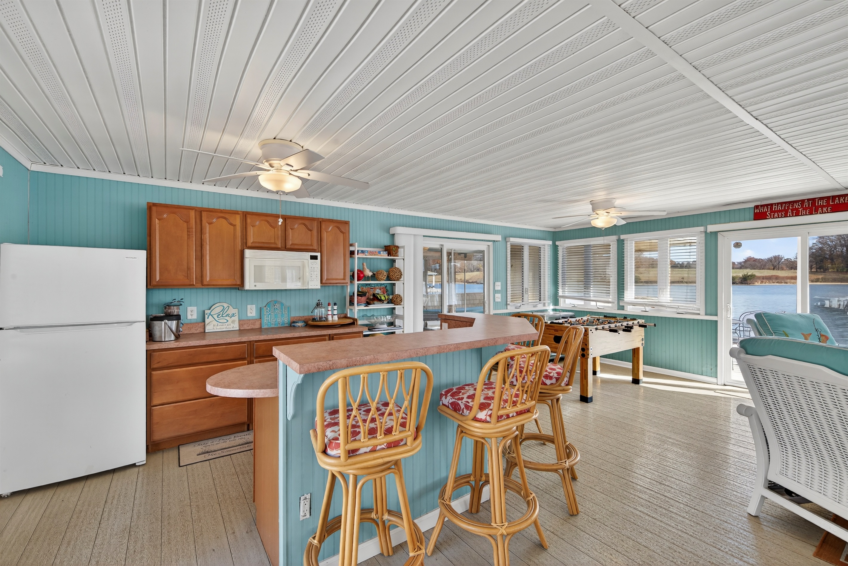 Enjoy a fully equipped boathouse kitchen with bar-height seating and plenty of space to gather.