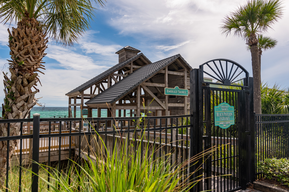 Beach pavilion and gated walkway to the Gulf