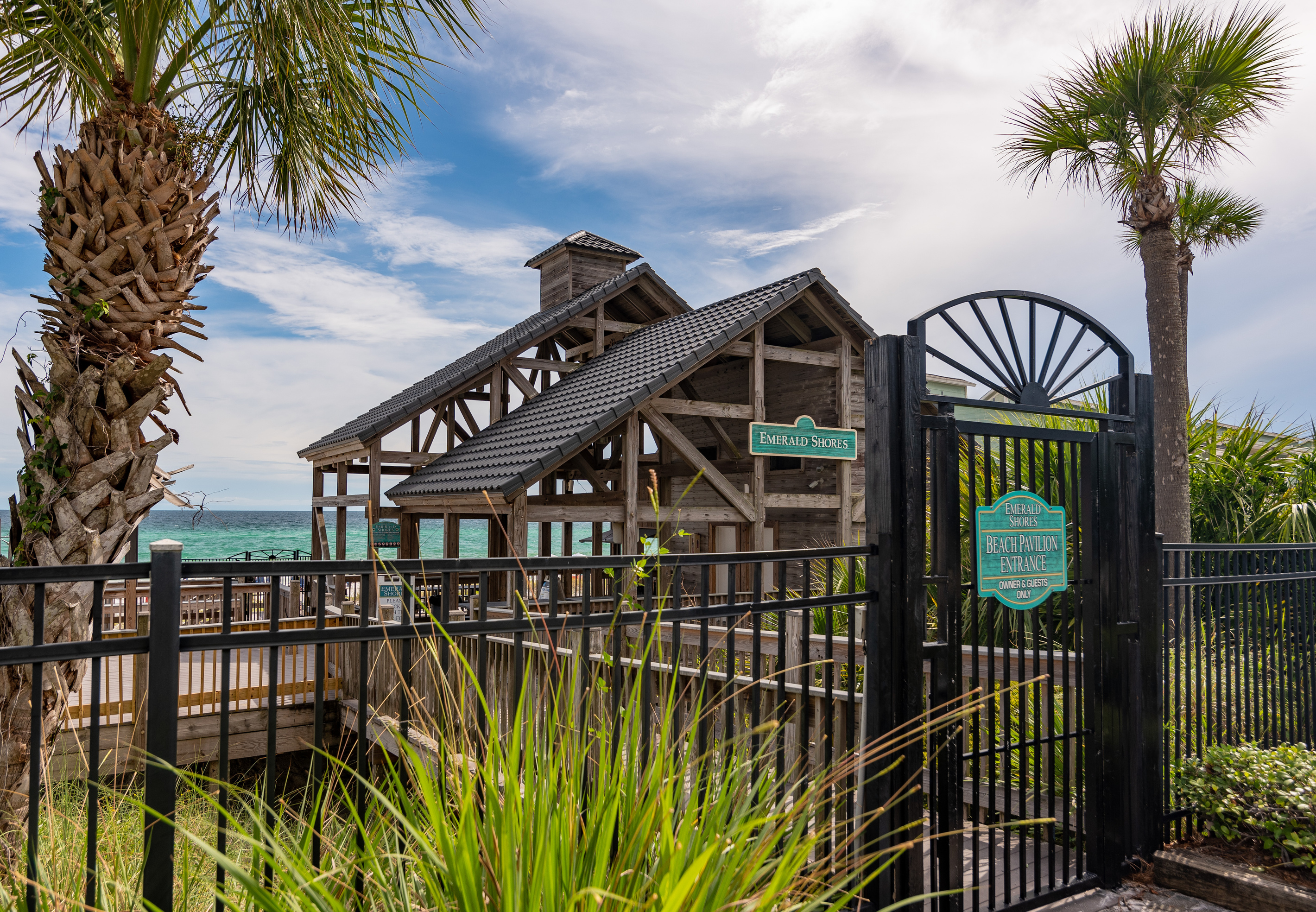 Beach pavilion and gated walkway to the Gulf