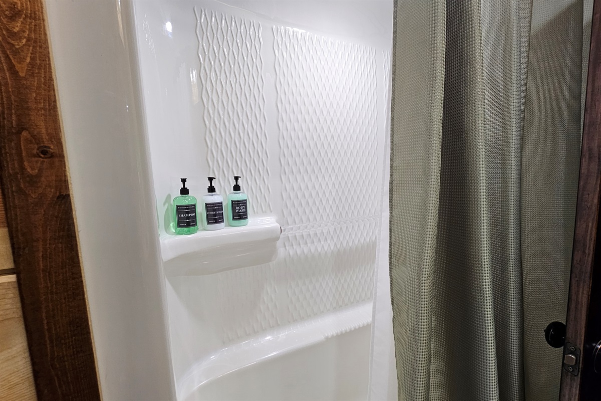 Two combo bath/showers shared by two king bedrooms each.