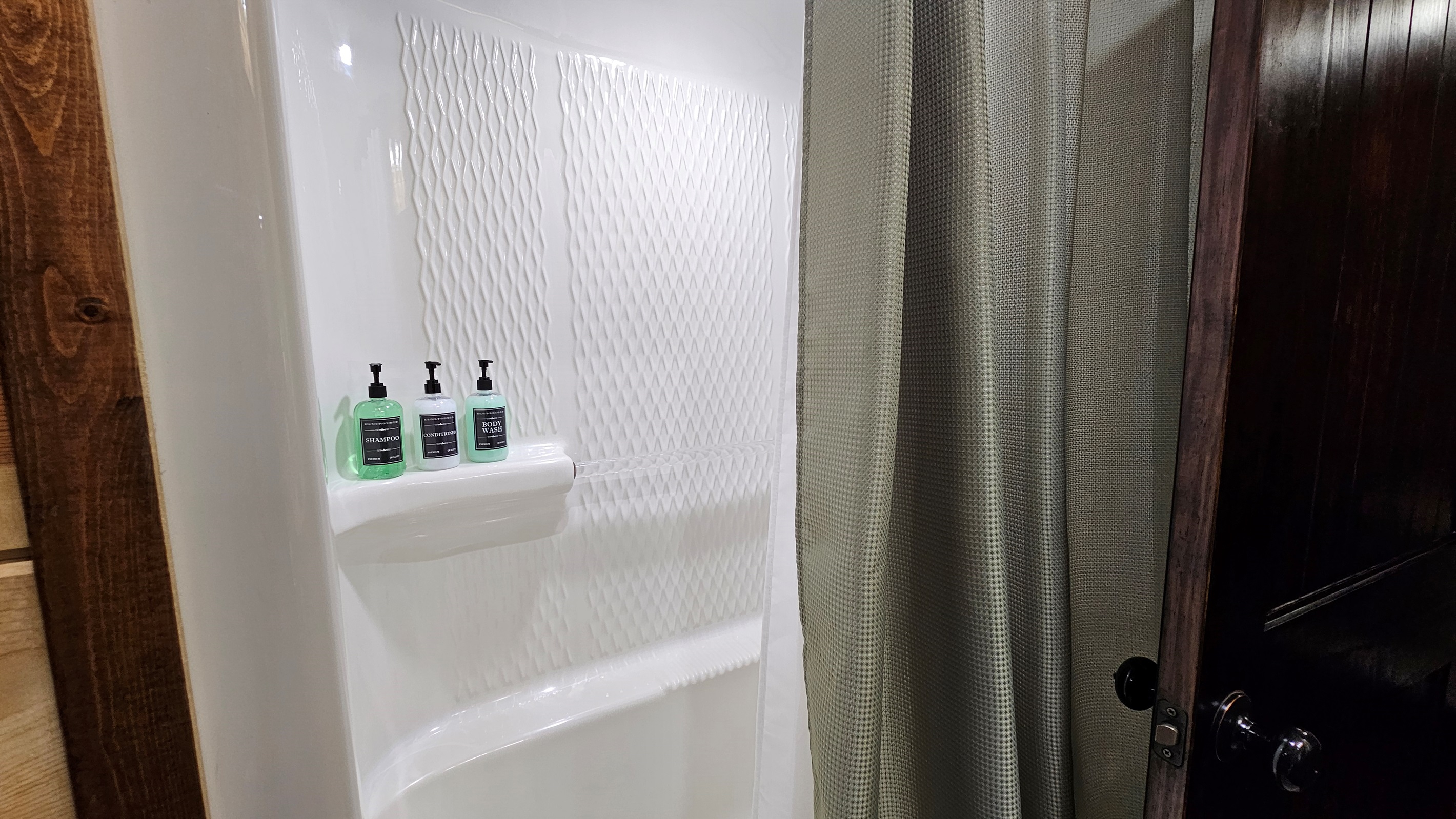 Two combo bath/showers shared by two king bedrooms each.