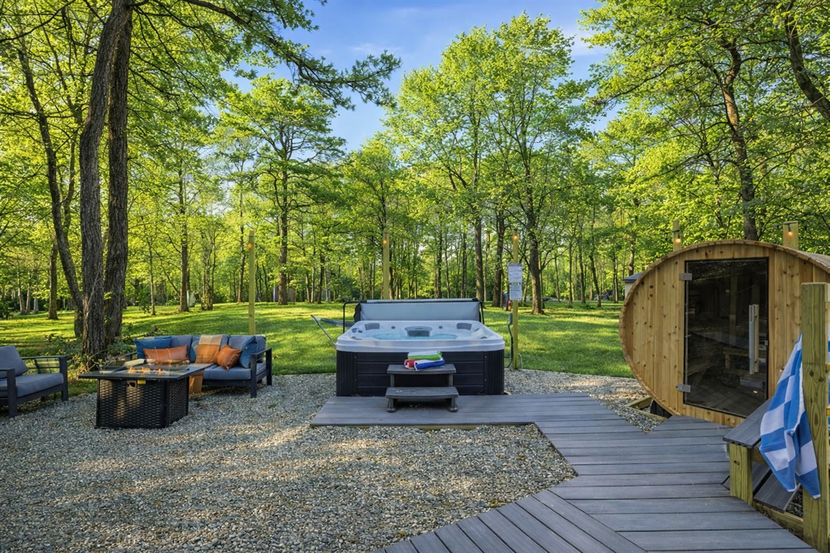 Unwind in your own private outdoor retreat. Soak in the hot tub, warm up in the sauna and gather by the fire in total peace