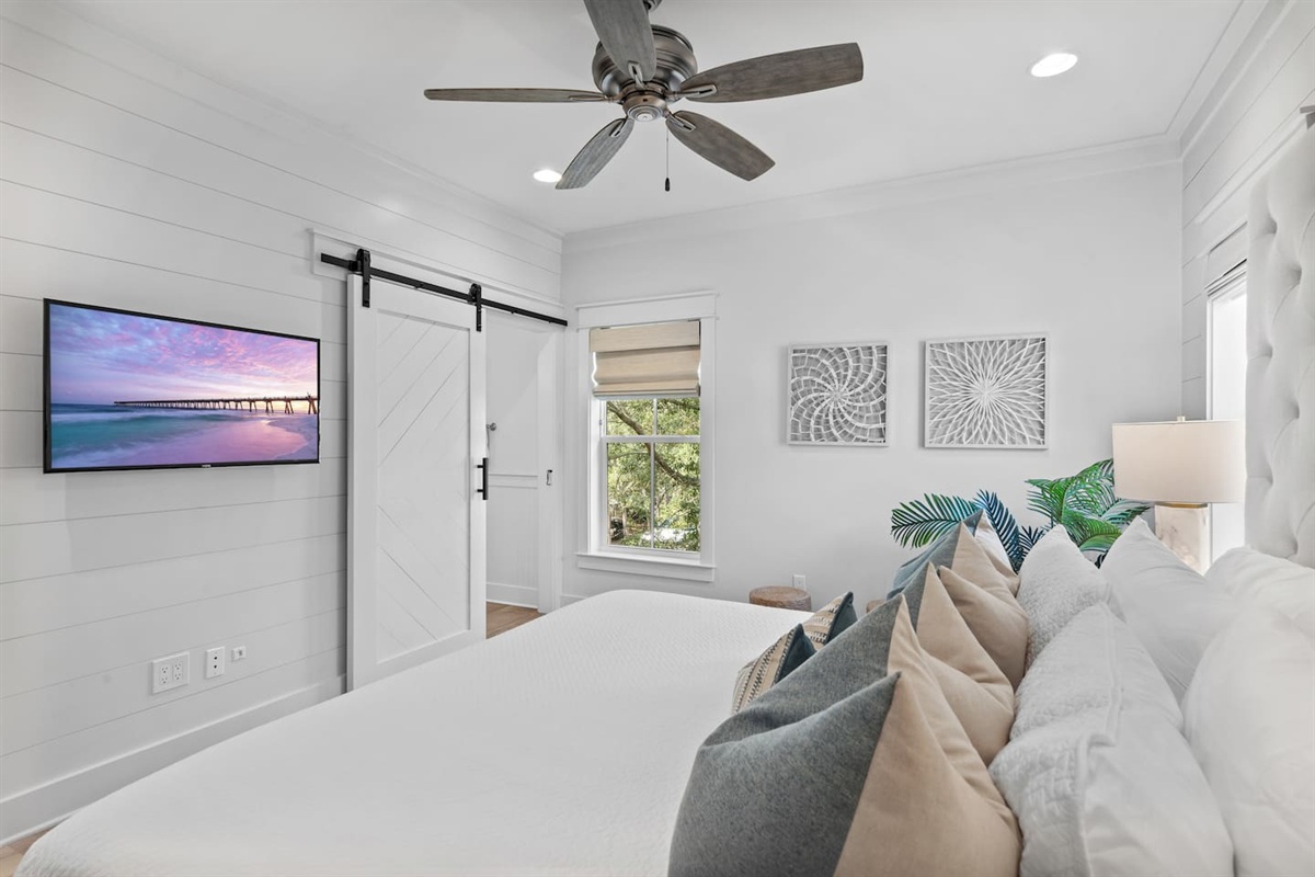 Spacious 2nd level king bedroom suite with full ensuite bathroom, tiled shower, dual vanity sinks, and newly remodeled outdoor shower.