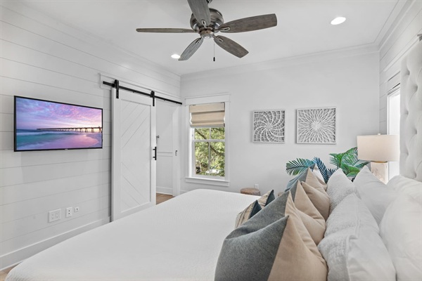 Spacious 2nd level king bedroom suite with full ensuite bathroom, tiled shower, dual vanity sinks, and newly remodeled outdoor shower.