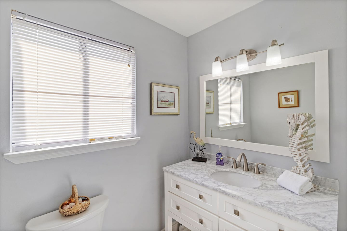 Run inside, use the half bath, and head back out to the beach without tracking sand through the whole house.