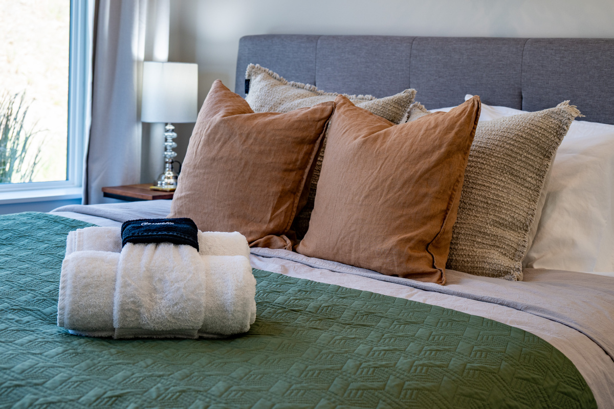 Premium linens, plush pillows, and thoughtful touches create a warm and inviting retreat for a restful night's sleep.