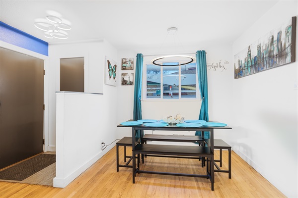 A dining area bathed in light blue tones, creating a calm and inviting space for enjoyable dining experiences.
