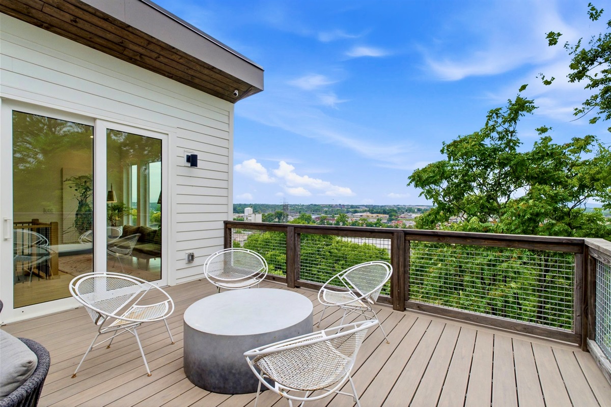 Sunny open deck w/ lounge chairs & wide-open sky — a bright spot to soak up the day.
