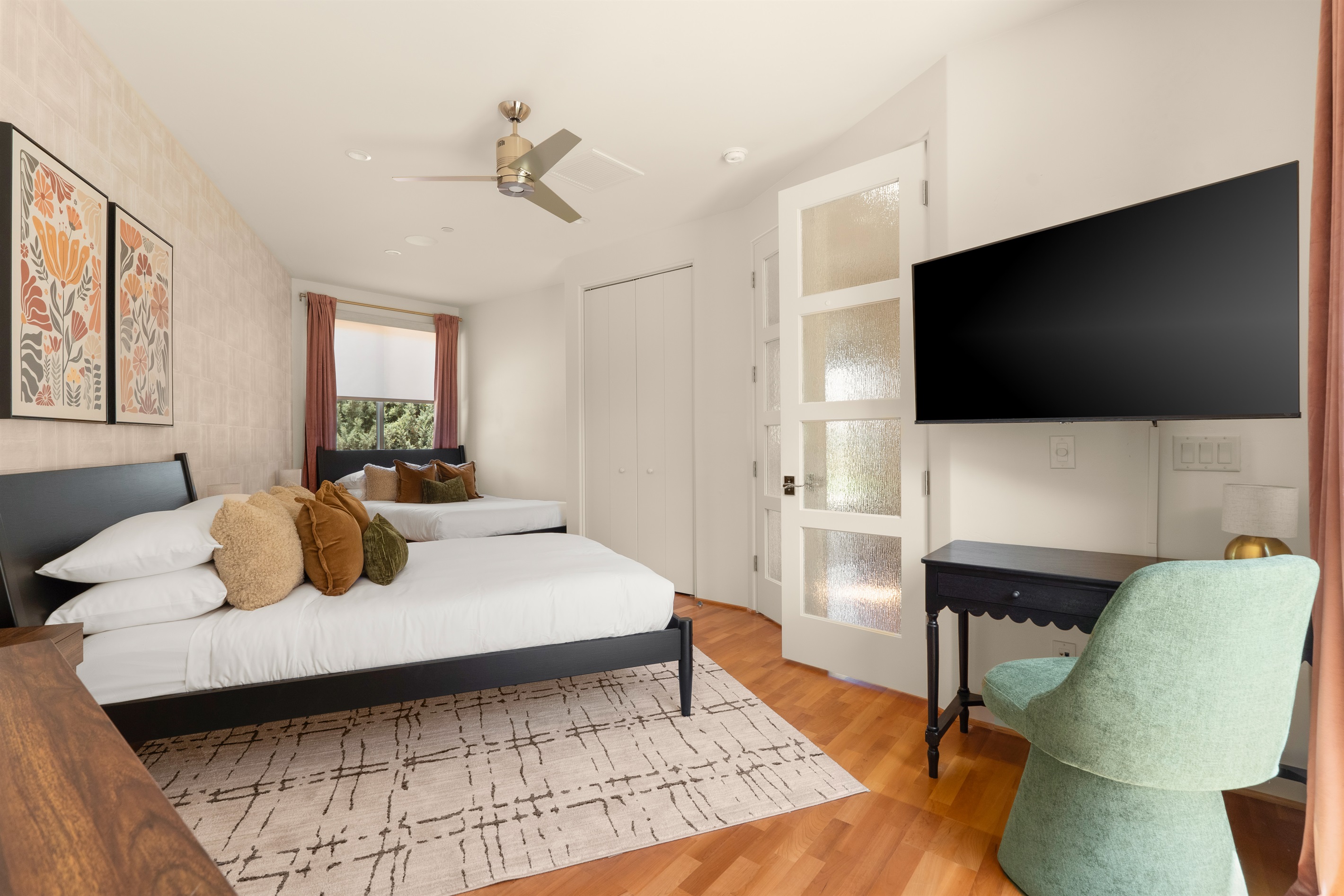 Perfect for families or groups. This spacious suite features two premium beds, a dedicated workspace, and a smart TV, providing ample room and comfort for everyone.