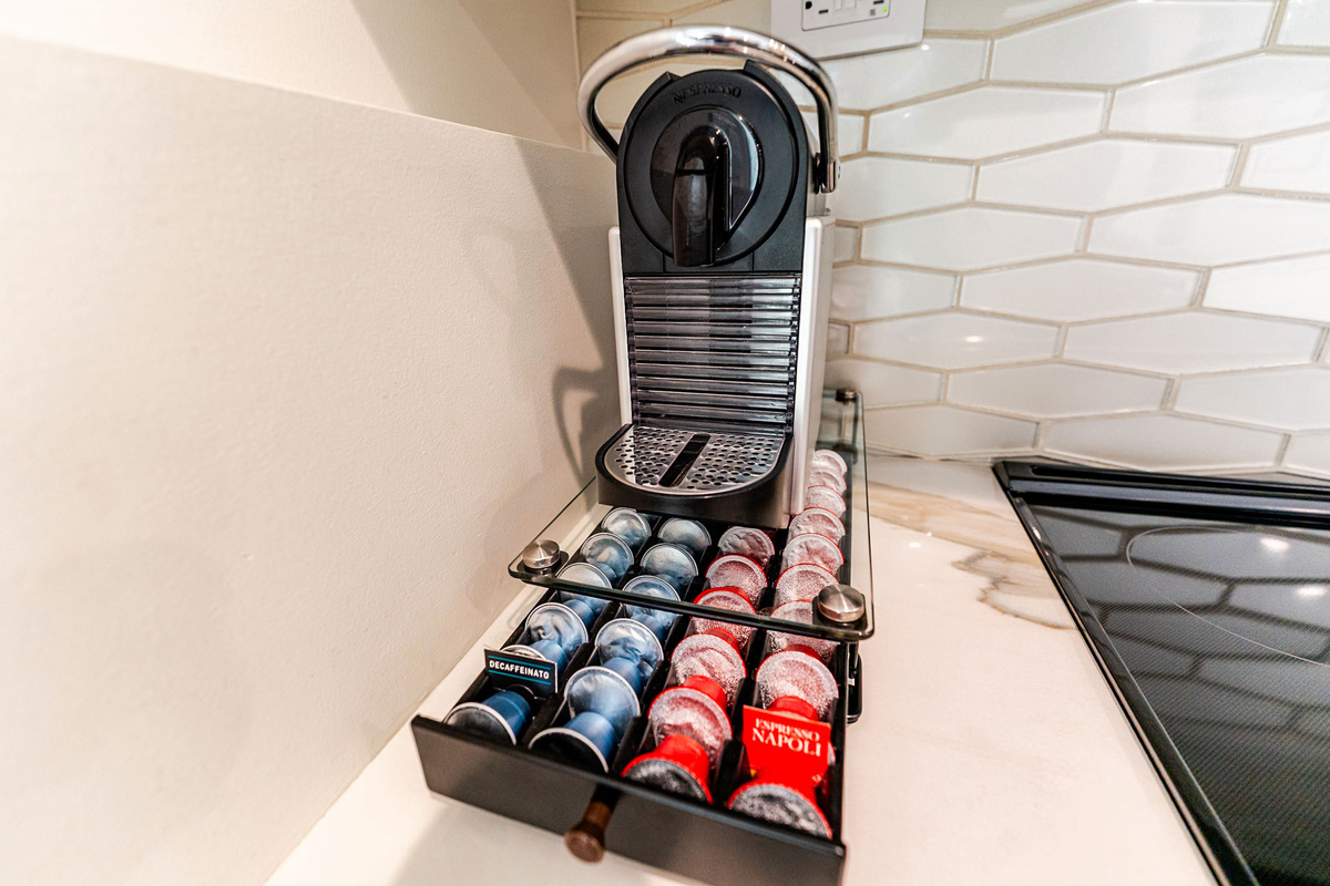 Well-stocked Nespresso-maker with espresso and decaf pods