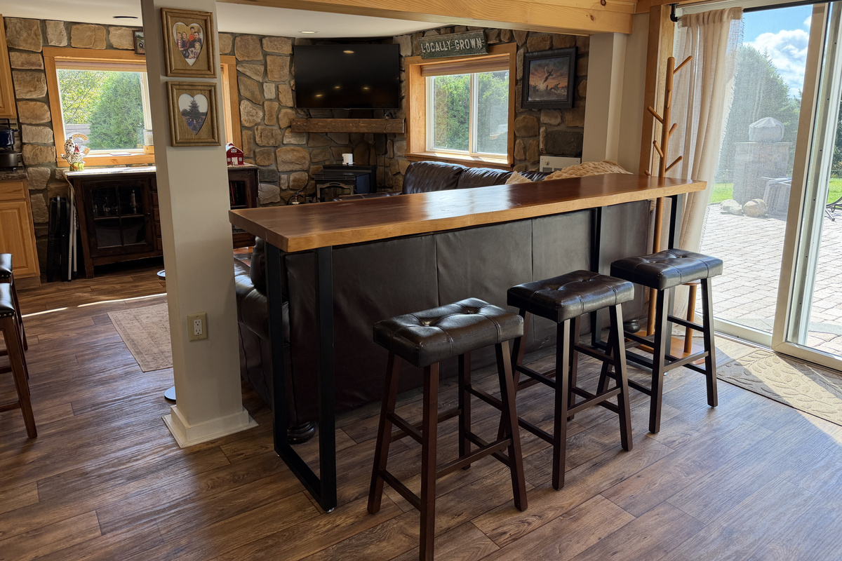 Bar seating behind the couch for snacking and cheering on your team