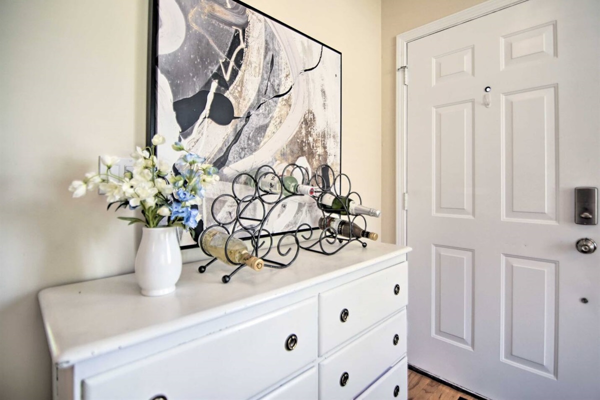 The cozy foyer and private front door entrance are accessed by contact-less  smart lock.