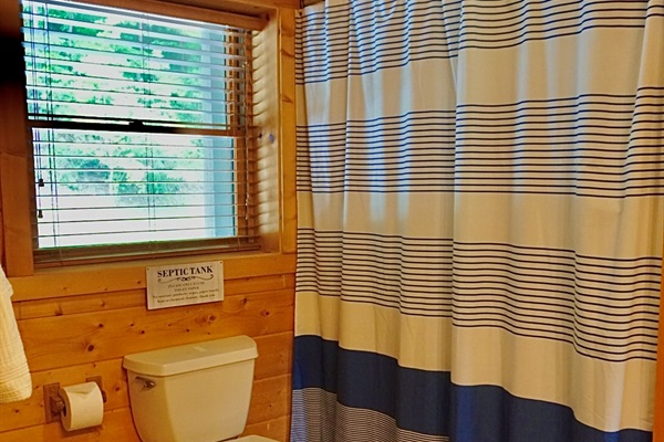 Bathroom Retreat: Bright space with natural light and nautical charm for refreshing moments!