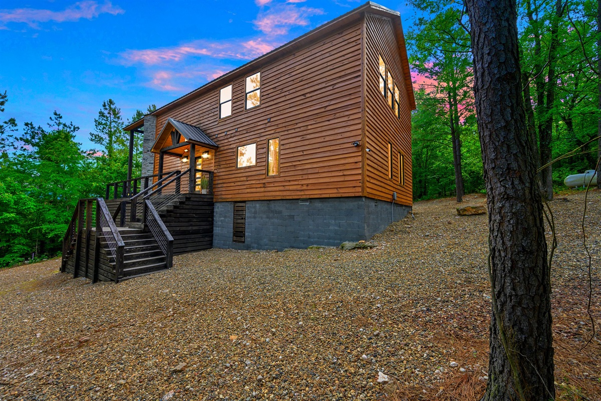 A warm cabin glow welcomes you home after a day of adventure. The perfect photo-worthy backdrop nestled in nature.
