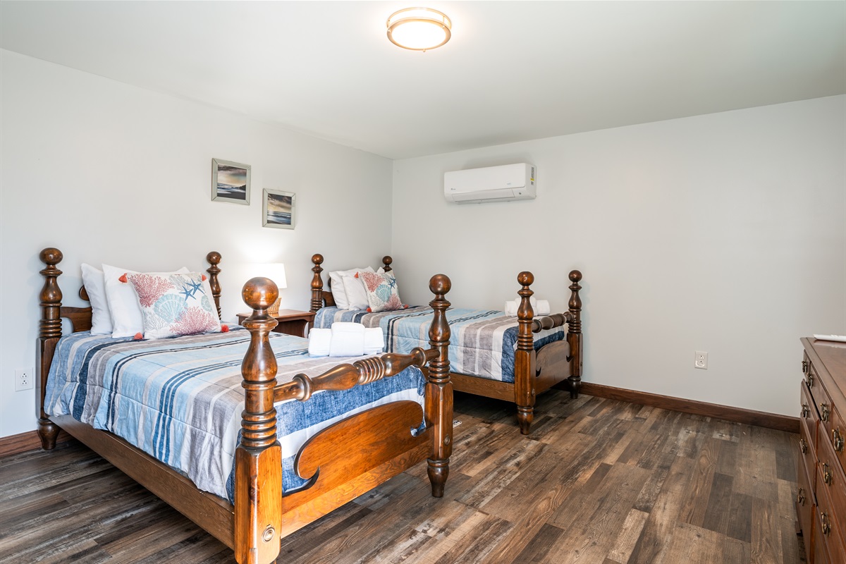 Charming vintage-style bedroom with cozy bedding and warm lighting—where old-world comfort meets modern convenience.