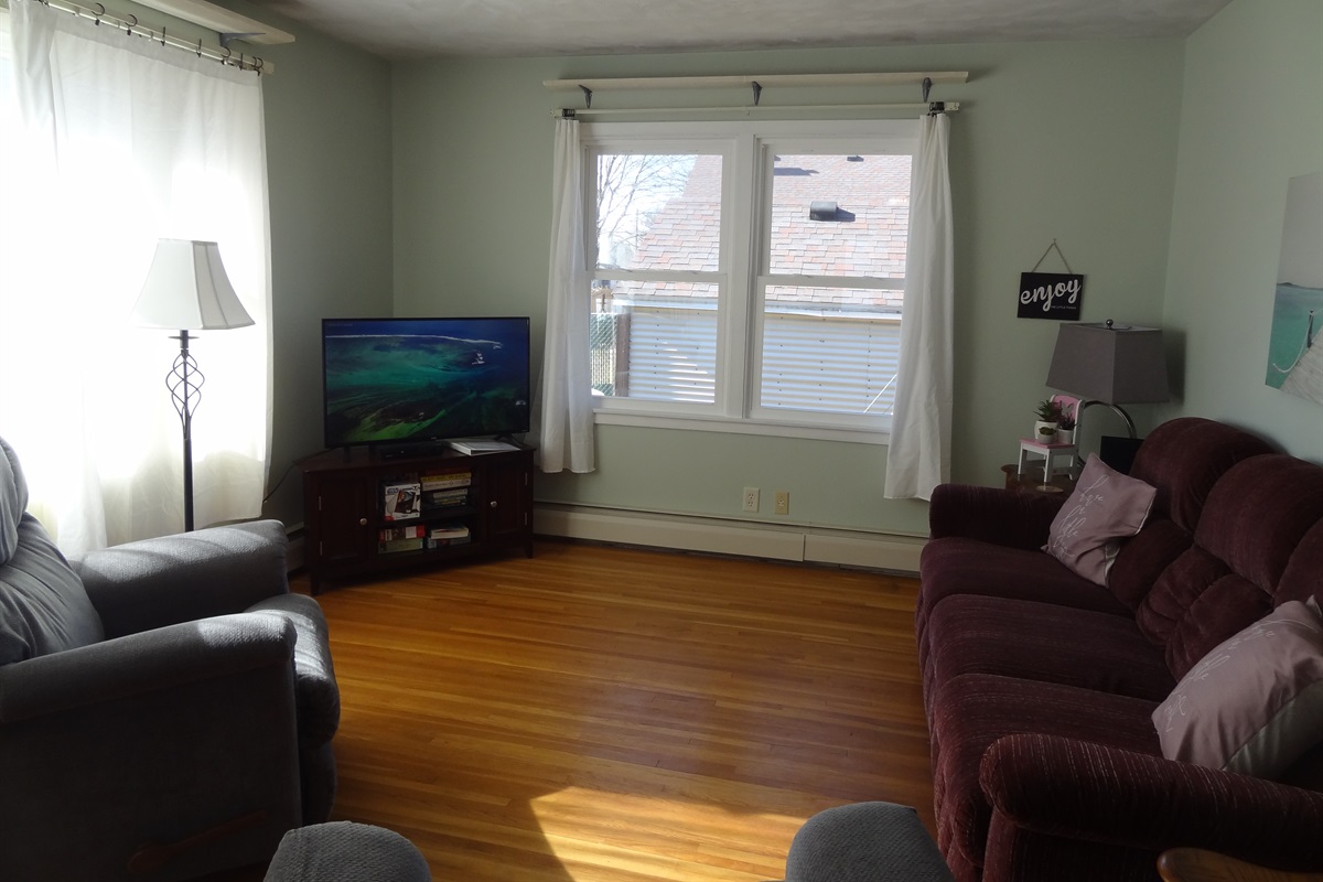 Full size couch, 2 recliners, Roku smart TV, laptop work space