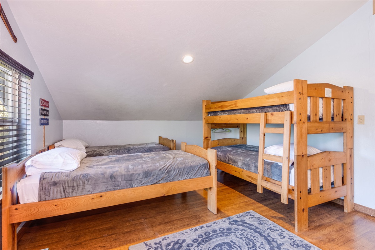 3rd floor bunk room- 2 sets of bunk beds and 4 twins for a total of 8 beds. 