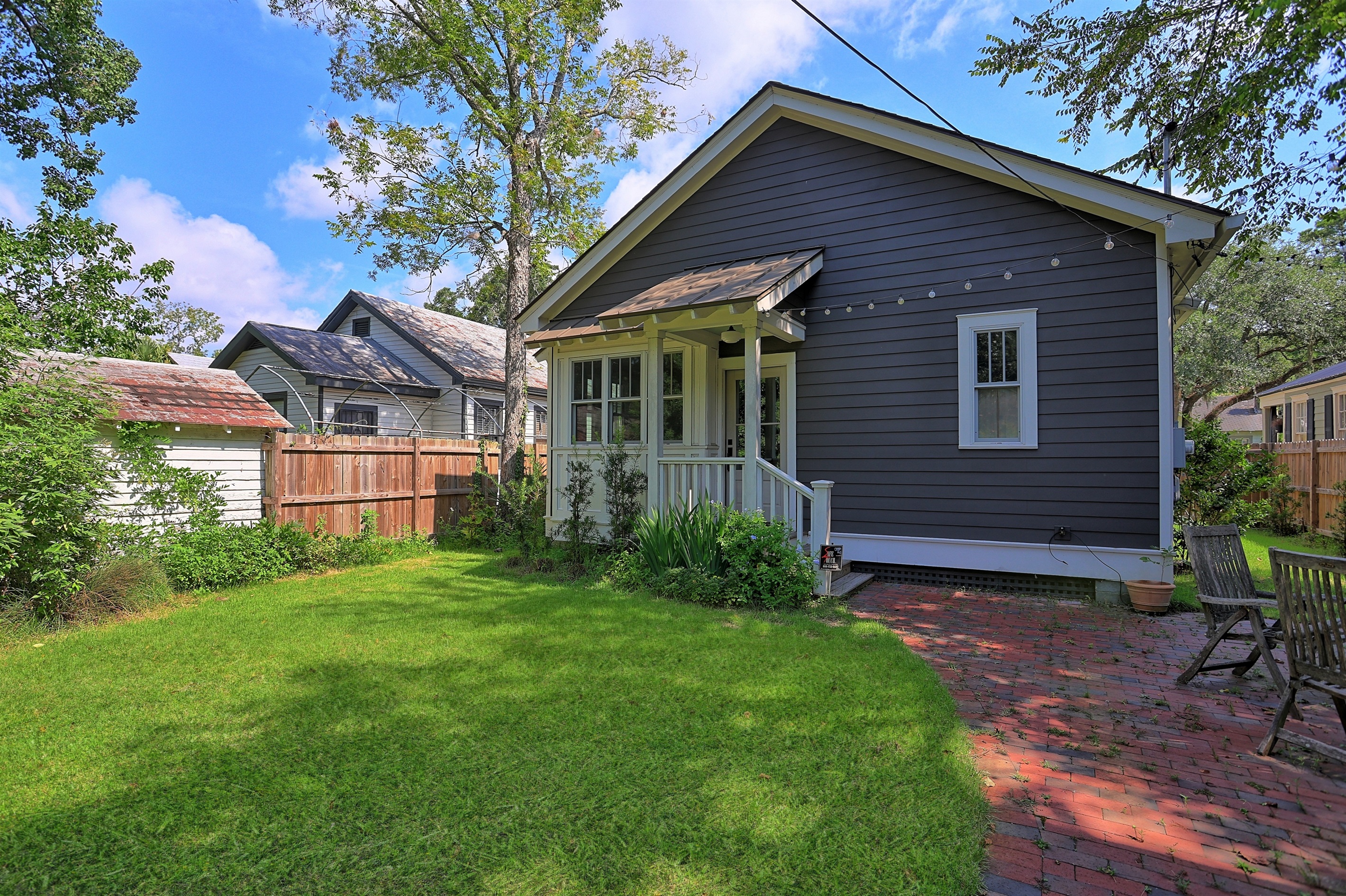 A lush, tranquil space perfect for relaxing or enjoying outdoor meals with family and friends.
