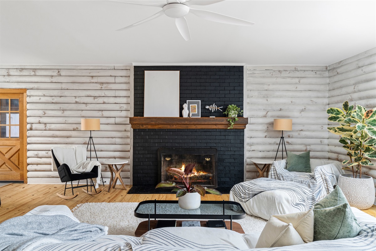 Living Room: Delight in this chic retreat with a stunning fireplace and modern rustic decor!