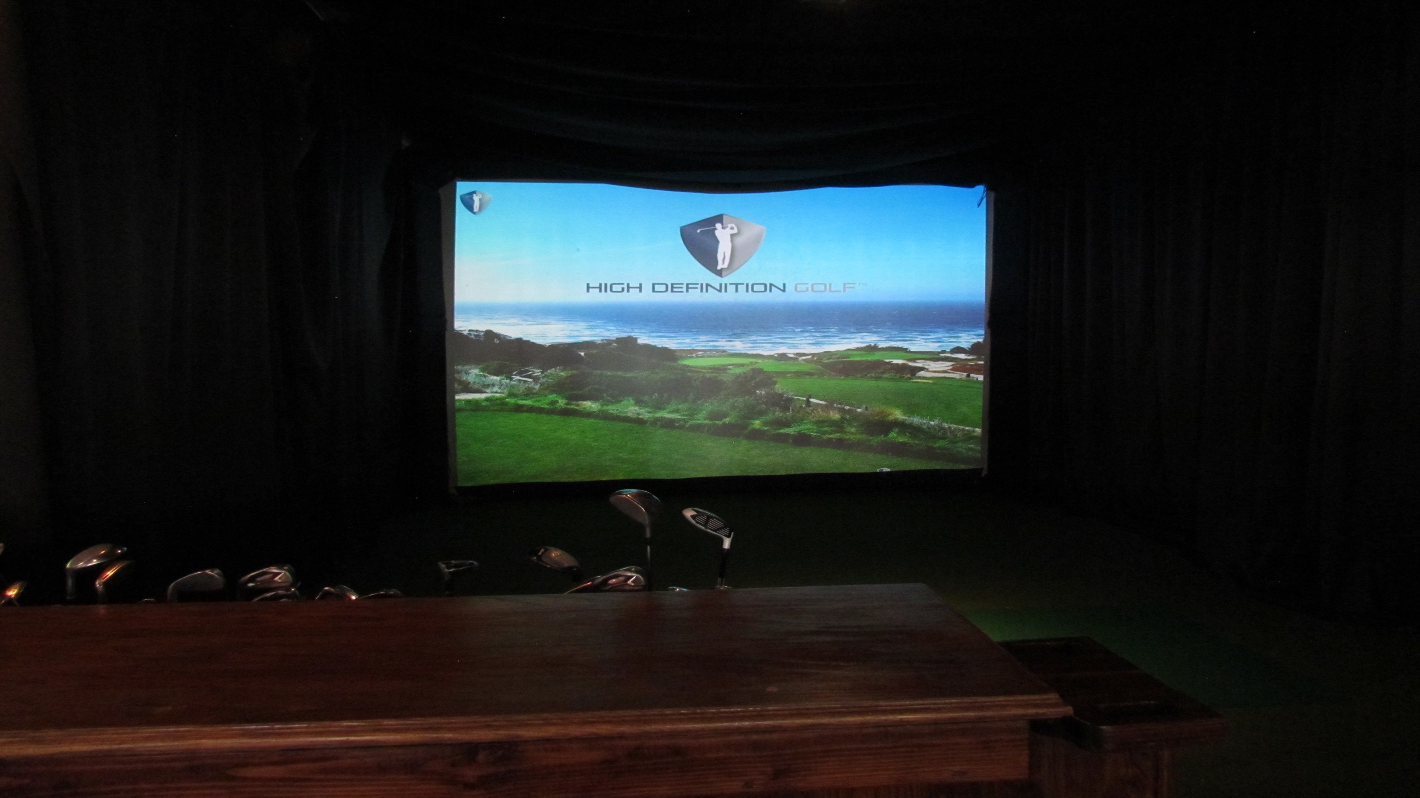 Hone your golf skills or enjoy a virtual round on a world-class course at Village Hideaway's high-definition golf simulator, perfect for both avid golfers and beginners.