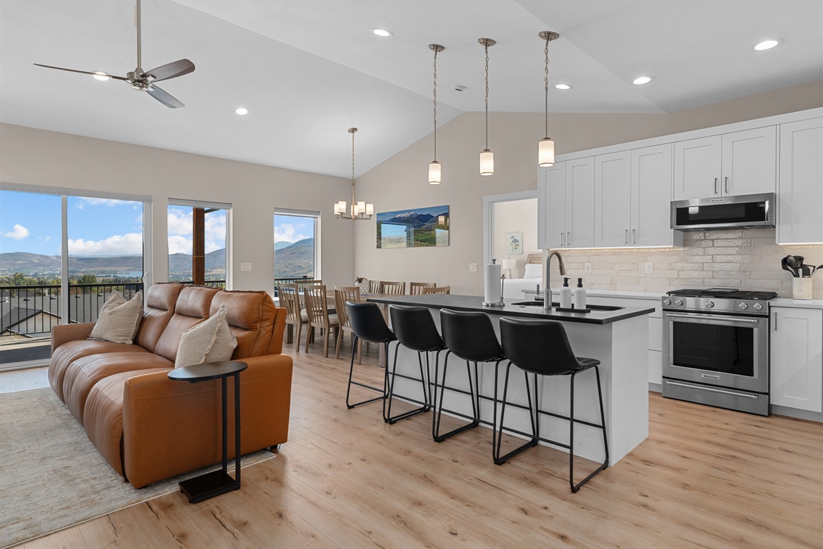 Bright, modern kitchen with a large island and seating for 4.