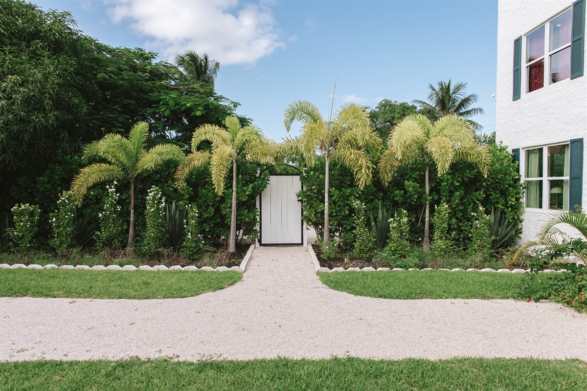 The garden of The Marisol features a spacious lawn, a walking path, hand-selected plantings and cozy, relaxing seating areas to take in the full beauty of the grounds.
