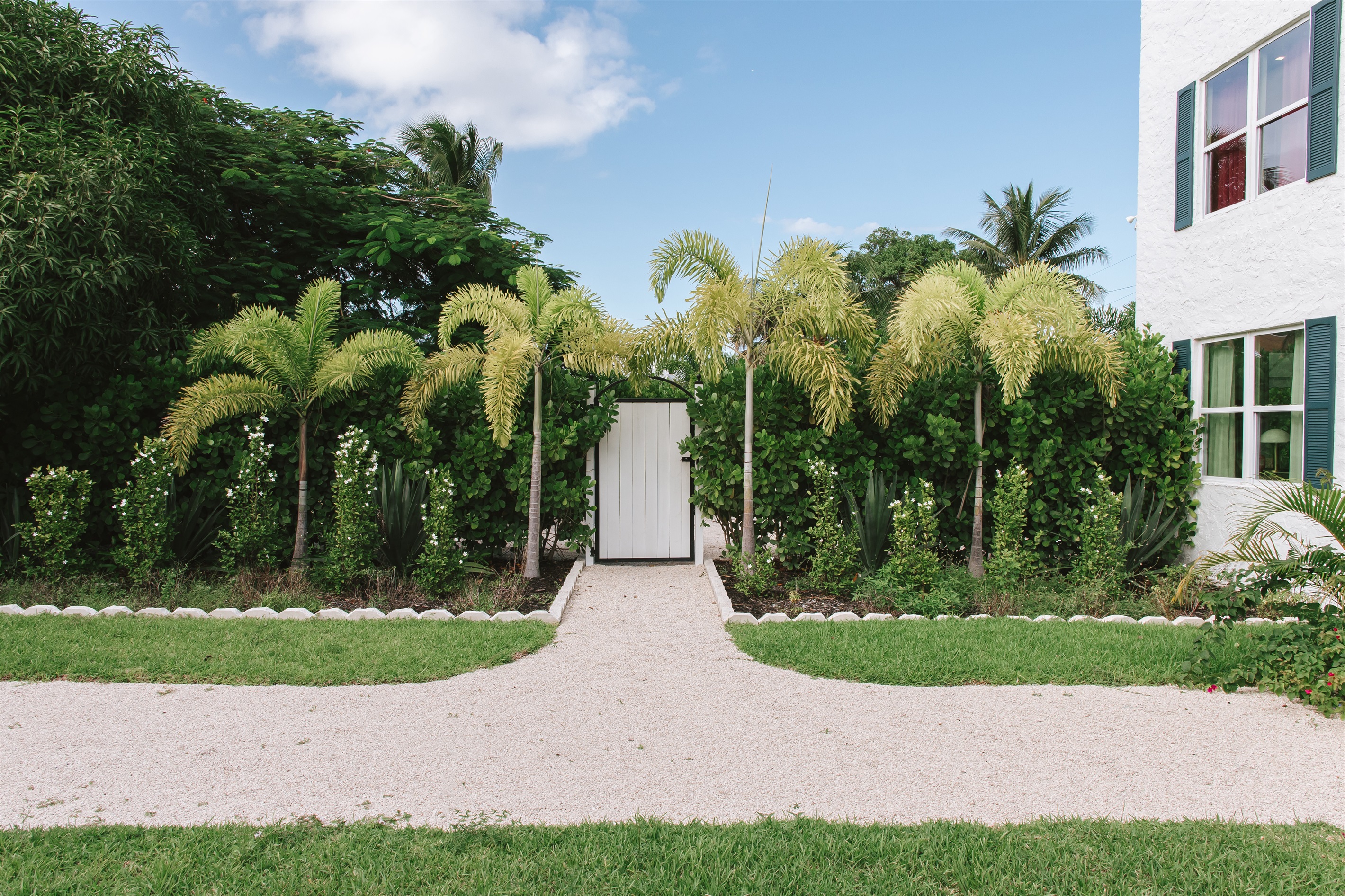 The garden of The Marisol features a spacious lawn, a walking path, hand-selected plantings and cozy, relaxing seating areas to take in the full beauty of the grounds.