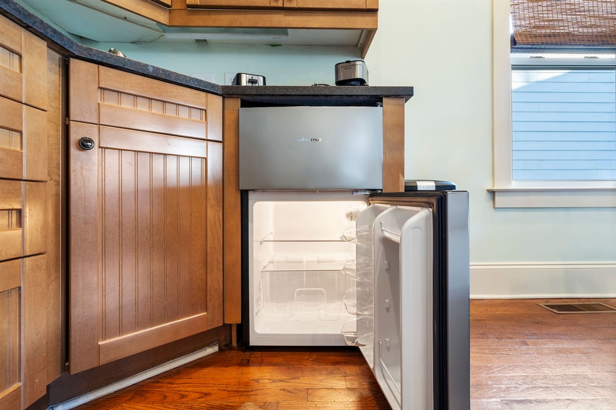 Apartment-size refrigerator — plenty of room for groceries, leftovers, and beach snacks