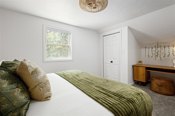 This bedroom's desk and vanity are perfect for work or play!