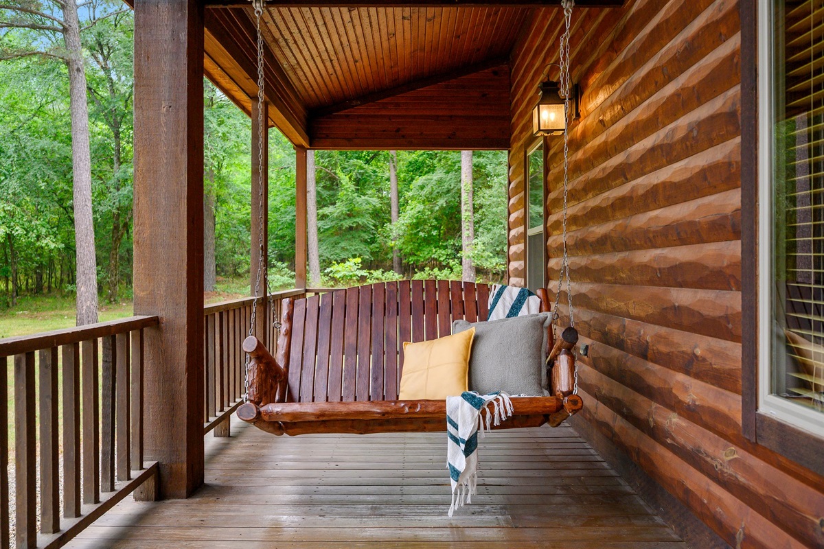 Perfect for slow mornings or peaceful afternoons, this wooden swing is a charming place to unwind and take in the forest views.